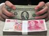 La Chine veut limiter les "perturbations" subies par le yuan