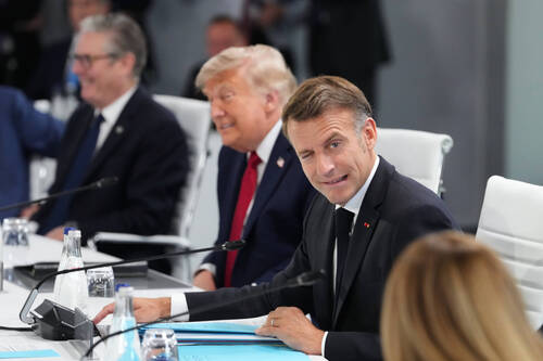 From left, British Prime Minister Keir Starmer, U.S. President Donald Trump, French President Emmanuel Macron and Italian Prime Minister Giorgia Meloni during a working session at the G7 summit in Evian-les-Bains, France, Wednesday, June 17, 2026. (AP Photo/Thibault Camus)
