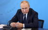 Poutine signe une loi alourdissant les peines pour reddition